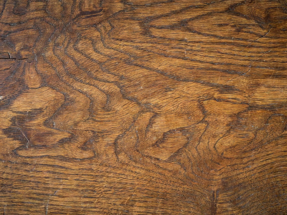 Detailed close up shot of natural aged wood grain patina on an oak cabinet